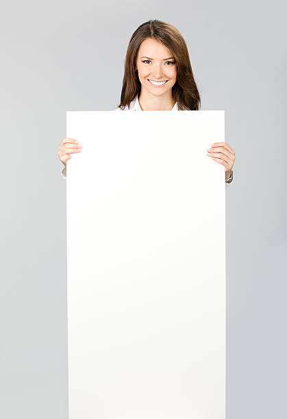 istock Businesswoman showing signboard, over grey 153065734