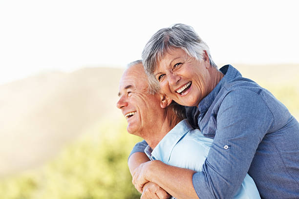 istock Smiling couple embracing outdoors 153068604