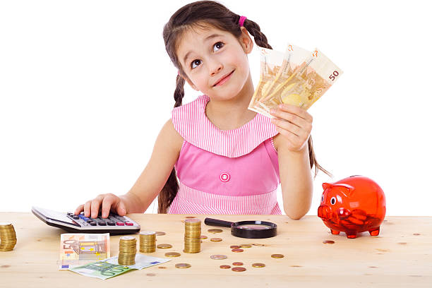 istock Girl at the table counts money 153068742