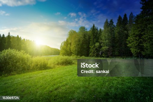 istock Beautiful sunset over forest lake 153069724