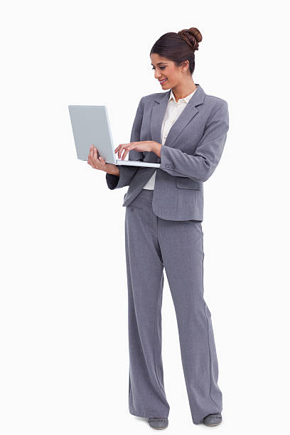 istock Smiling female entrepreneur working on her laptop 153070022