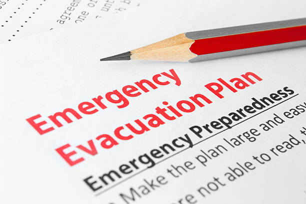 Emergency evacuation plan Close-up of Emergency plan with pencil on it flood preparation stock pictures, royalty-free photos & images