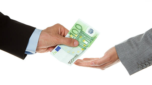 istock Man giving 100 euro to a woman (business) 153070607