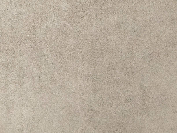 istock Concrete grunge wall texture. Beige abstract background, an old plaster cement surface. 1530716395