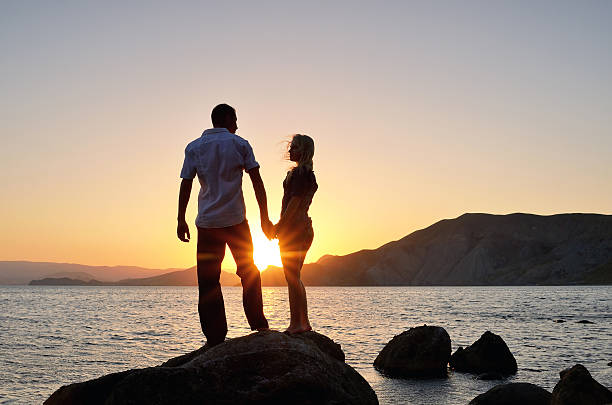 istock Boy and girl look at each other on beach 153072831