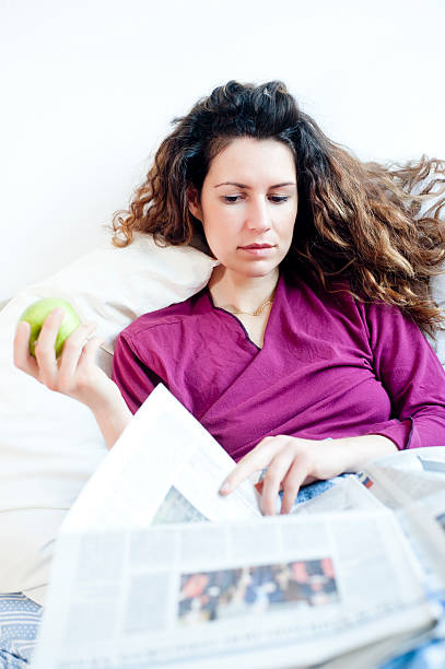 istock Reading the morning news in bed 153073286