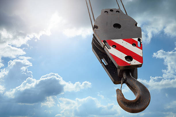 Crane hook on a blue sky stock photo