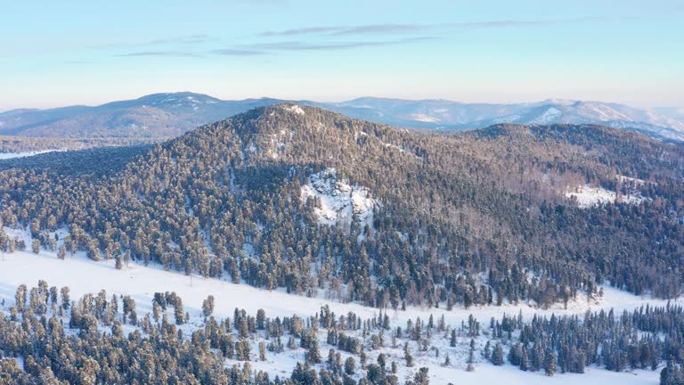 Altai mountains in winter: Seminsky Ridge and Seminsky Pass. Aerial view.