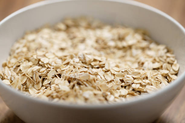 istock oat flakes in white bowl on wood table 1530738049