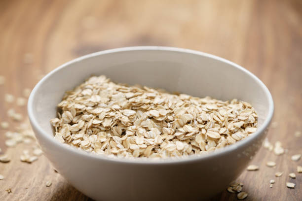 istock oat flakes in white bowl on wood table 1530743245
