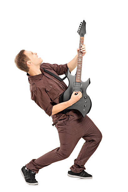 estrella de rock tocando guitarra - isolated on white studio shot guitar young men fotografías e imágenes de stock