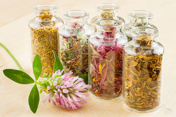 istock healing herbs in glass bottles 153074960