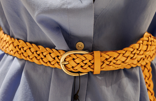 Close-up of women's clothing and belts