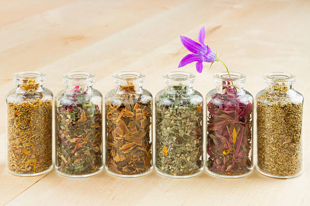 istock healing herbs in glass bottles 153075940