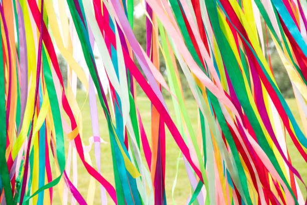 istock Multi-colored ribbons as a background fly in the window 1530776171