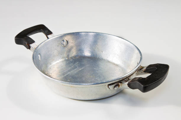 istock Old aluminum pan seen from above on white background 1530776426
