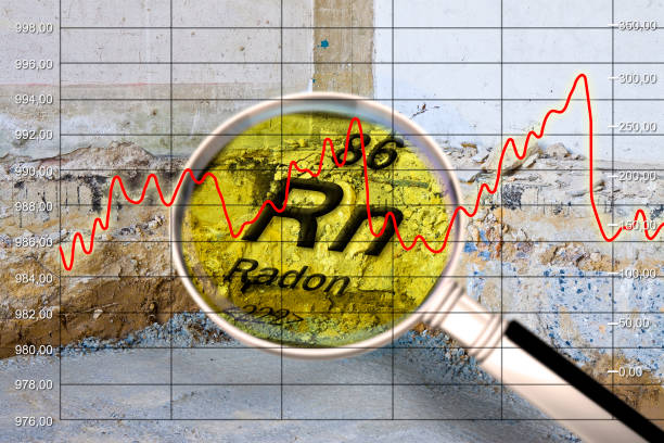 Preparatory stage for the construction of a ventilated crawl space in an old brick building - Searching gas radon concept image seen through a magnifying glass whit graph stock photo