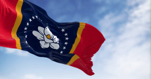 istock Mississippi state flag waving in the wind on a clear day 1530776937