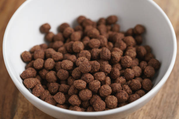 istock chocolate cereal balls in white bowl for breakfast on wooden table 1530778680
