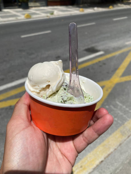 istock Ice Cream Holding in Street with Cup. Take Away. 1530779096