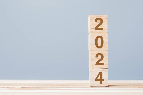 istock wooden cube block with 2024 text on table background. Resolution, plan, review, goal, start and New Year holiday concepts 1530779401