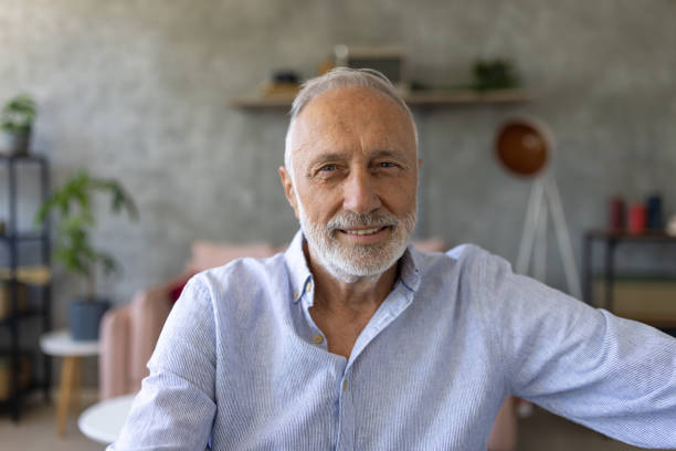 istock Portrait of a senior man sitting at a table 1530782639