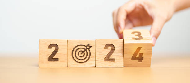 2023 year change to 2024 year block with dartboard icon. Goal, Target, Resolution, strategy, plan, Action, mission, motivation, and New Year start concepts