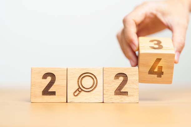 istock 2024 block with magnifying glass icon. SEO, Search Engine Optimization, hiring , Advertising, Idea, Strategy, marketing, Keyword, Content and New Year start concepts 1530783719