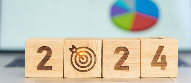 istock 2024 Year block with dartboard icon against computer laptop background. Goal, Target, Resolution, strategy, plan, Action, mission, motivation, and New Year start concepts 1530785293