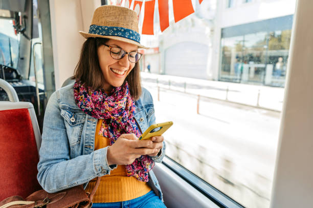 istock Young Woman Using Phone While Riding On A Tram In Istanbul 1530786361