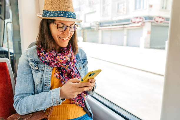 istock Young Woman Using Phone While Riding On A Tram In Istanbul 1530789567