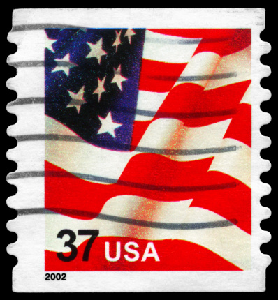 A Stamp printed in USA shows the U.S. Flag, circa 2002