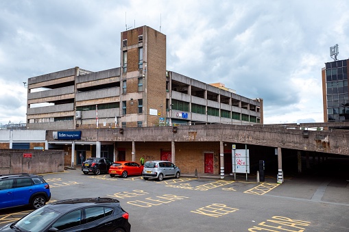 Eccles Manchester, United Kingdom – June 24, 2023: Decaying urban architecture with graffiti, neglected and closed multi storey carpark , in Eccles Manchester