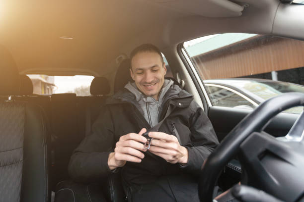 istock Joyful indian man driving car, shot from dashboard, going on trip during summer vacation, copy space. Happy middle-eastern guy in casual outfit and glasses driving his brand new nice car 1530805075