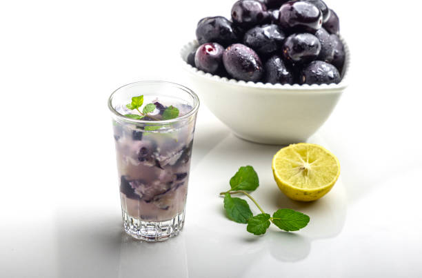 refreshing black plum mojito: muddled delight with lemon and mint - plum fruit organic food and drink imagens e fotografias de stock