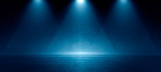 istock Stage shows, Dark blue background, an empty dark scene, laser beams, neon, spotlights reflecting on the asphalt floor, and a studio room with smoke floating up, a night view of the street, the city 1530823523