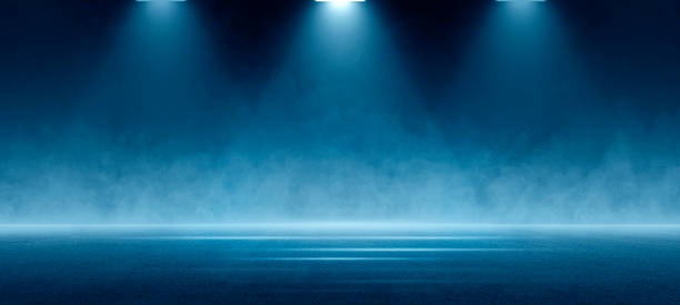istock Stage shows, Dark blue background, an empty dark scene, laser beams, neon, spotlights reflecting on the asphalt floor, and a studio room with smoke floating up, a night view of the street, the city 1530824666