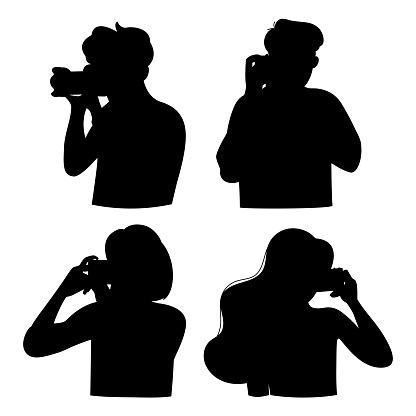 Silhouette people with photo camera. A woman and a man are taking a photo. World photography day