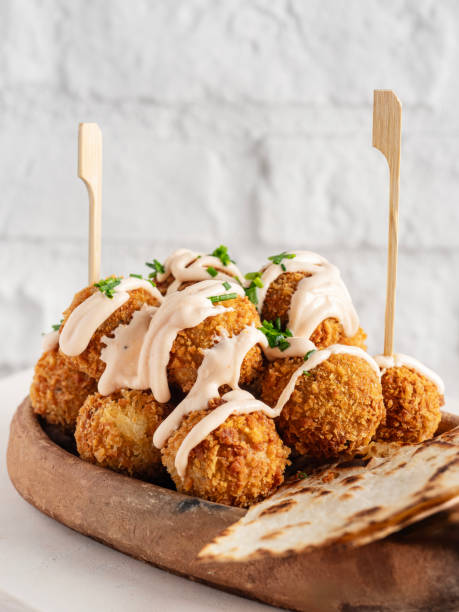 Falafel, Fried falafel balls, Falafel with bread, Chickpeas falafel with tahini sauce isolated on white background stock photo