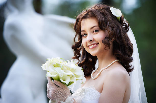 istock Happy bride with white wedding bouquet 153084050