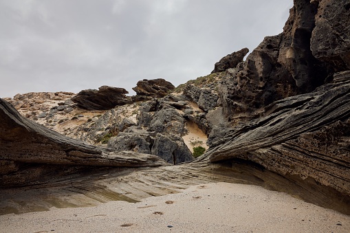 The large rock formations on the sandy beach in De Hoop Nature Reserve, South Africa.