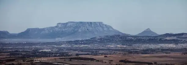A panoramic shot of Table Mountain and Lionshead from Paarl in South Africa.