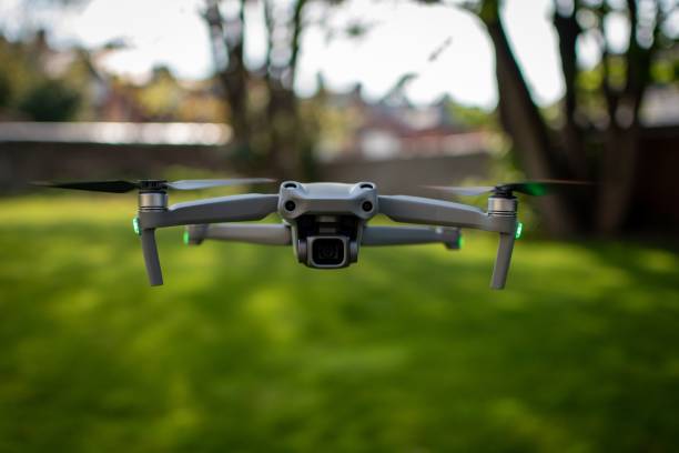 istock Closeup shot of a camera drone hovering  over lush grass 1530846981
