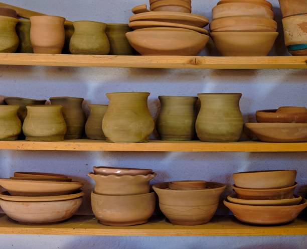 istock Selection of ceramic bowls arranged on wooden shelves 1530849267