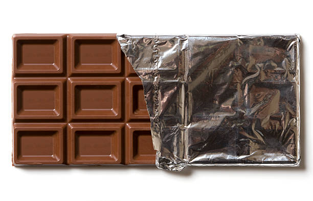 Chocolate Chocolate in silver foil. chocolate bar photos stock pictures, royalty-free photos & images