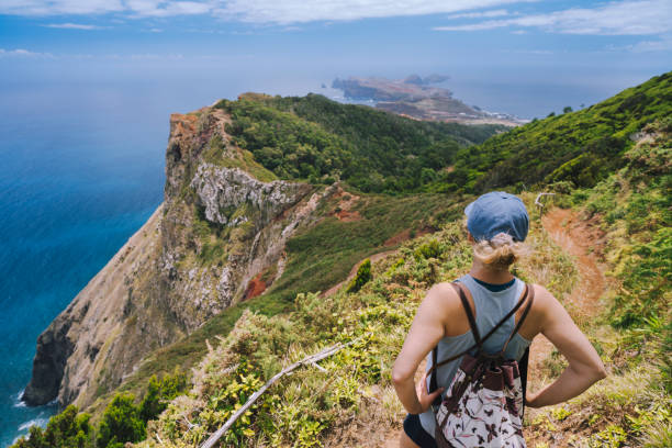 Woman looking at Ponta de Sao Lourenco peninsula in Madeira Portugal stock photo