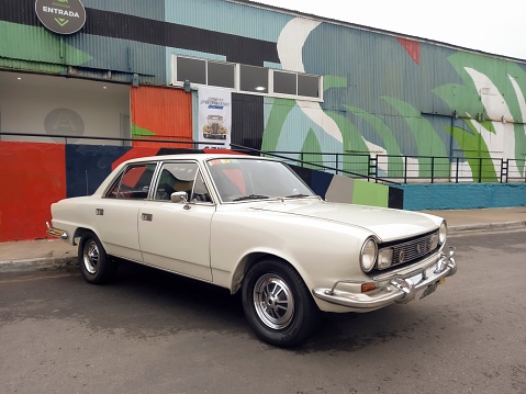 Avellaneda, Argentina – May 07, 2023: An old white 1970s IKA Renault Torino sedan in the street