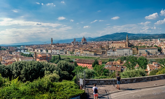 A panoramic view of Florence, young people are watching the Florence architecture on the background