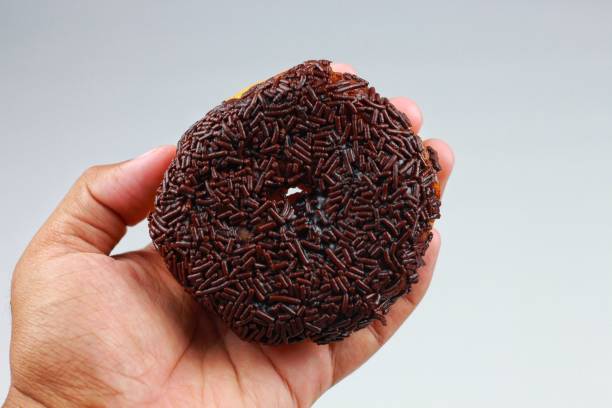 istock Tasty chocolate donut, isolated on white. 1530877415
