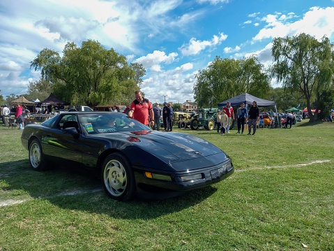 Chascomus, Argentina – April 16, 2023: Old black sport 1980s Chevrolet Corvette C4 two door coupe hardtop in the countryside